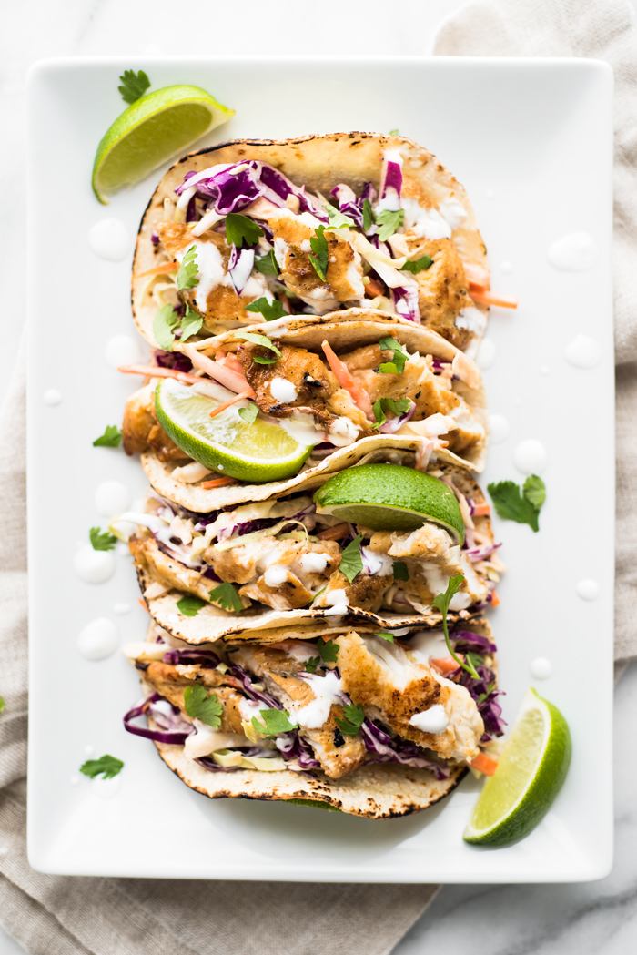 A perfect meal - these Fish Tacos with Sriracha Aioli Slaw are light, packed with flavor, and super easy to make!