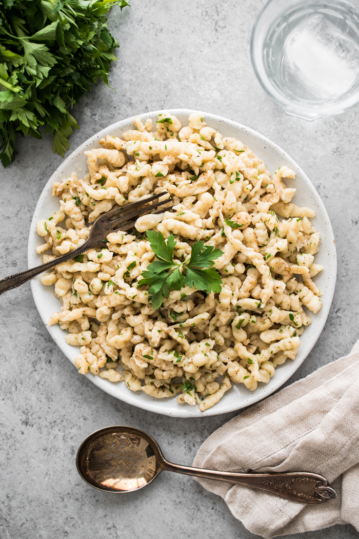 Spaetzle, or 'little sparrows' are a German staple. These small egg dumplings are tossed with brown butter, nutmeg, parsley, and are irresistible!