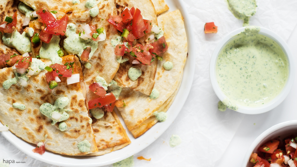 These Chorizo Quesadillas with Cilantro-Lime Sour Cream have a crispy outside, ooey-gooey, cheesy goodness with flavorful chorizo inside, and topped with zesty cilantro-lime sour cream and fresh pico de gallo - it's perfect for a party.