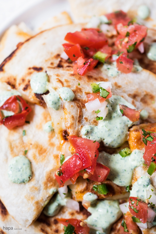 These Chorizo Quesadillas with Cilantro-Lime Sour Cream have a crispy outside, ooey-gooey, cheesy goodness with flavorful chorizo inside, and topped with zesty cilantro-lime sour cream and fresh pico de gallo - it's perfect for a party.