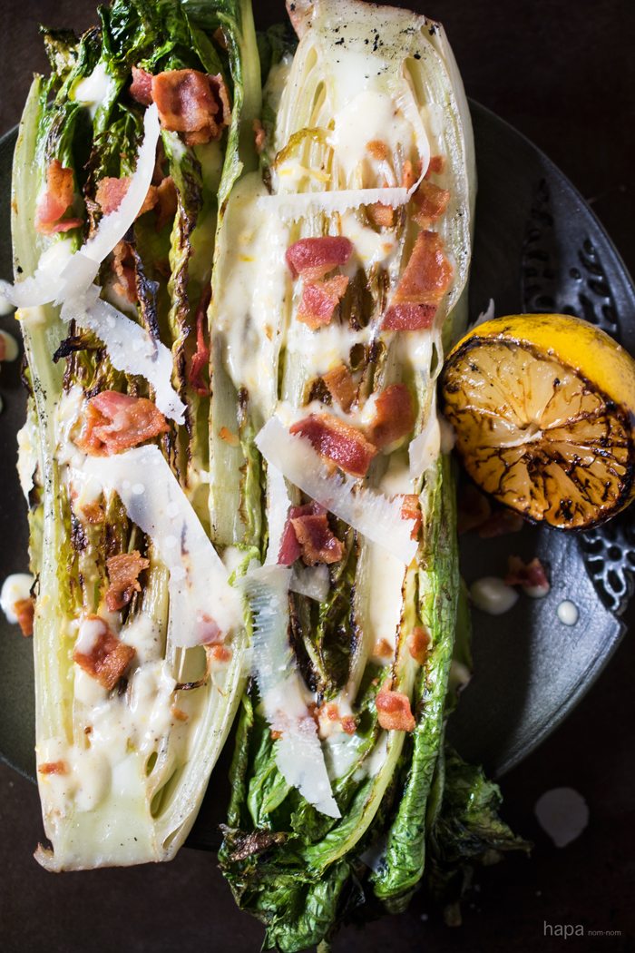 Char grilled romaine hearts, tangy dressing, crispy bacon, and nutty parmesan cheese. You've got to give this Grilled Romaine Lettuce with Creamy Lemon Dressing a try! 