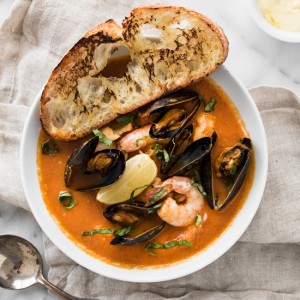 Easy, One Pot Bouillabaisse - Fresh fish, mussels, clams, and shrimp in a rich tomato-based broth
