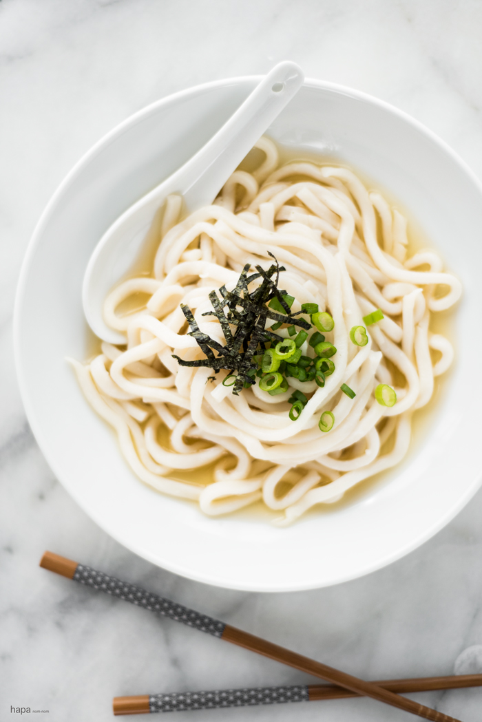 A big bowl of warm, comforting Udon Noodles in a rich and perfectly clear consomme.