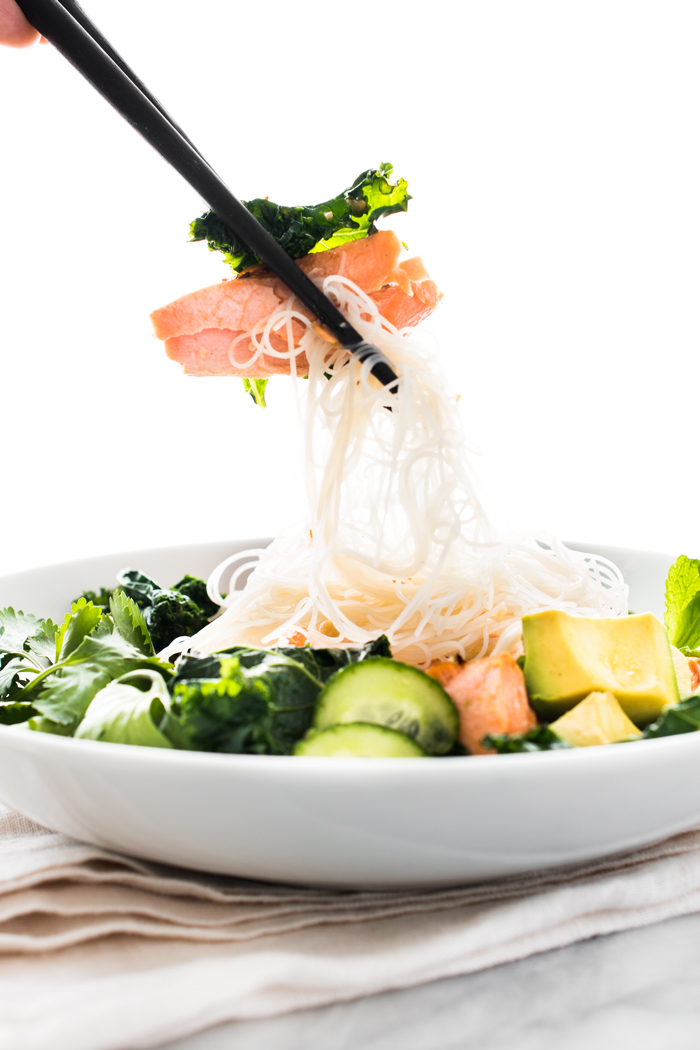 This noodle bowl is jam-packed with goodness! Pan seared salmon, garlicky kale, avocado... the list of greens goes on! Each bite is nutrient-rich and delicious!