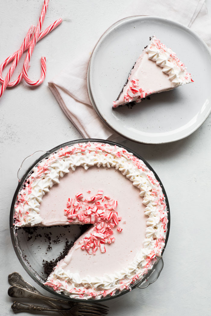 Fun, festive, and SO easy to make! This Candy Cane Ice Cream Pie is a dessert that everyone will love and it's totally customizable!