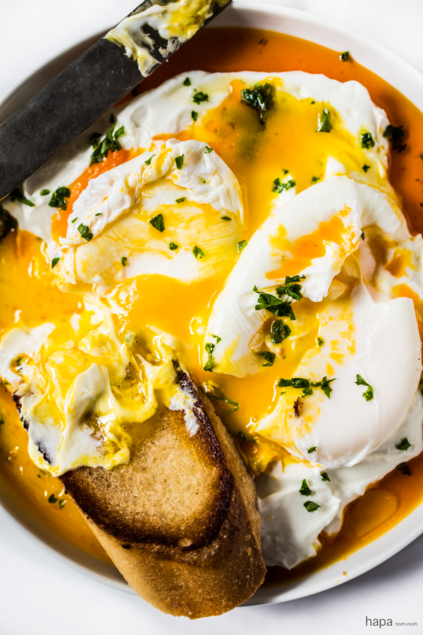 Dense garlicky yogurt swirled into a spiced butter and the richness of a poached egg. Dip a warm piece of toasted rustic bread into the golden sunrise of colors, and you've got heaven on a plate.