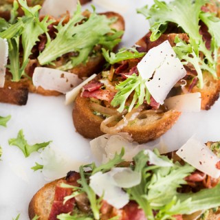 Caramelized Onion and Bacon Crostini with Green Herb Mayo, Frisée, and Parmesan