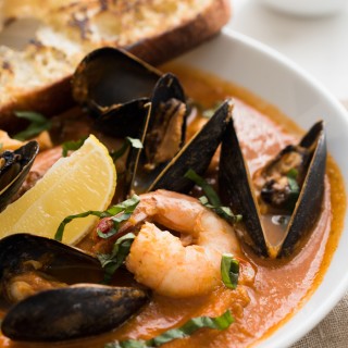 Easy Bouillabaisse - Fresh fish, mussels, clams, and shrimp in a rich tomato-based broth
