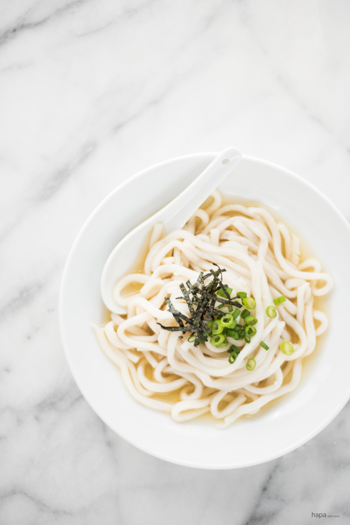 A big bowl of warm, comforting Udon Noodles in a rich and perfectly clear consomme.