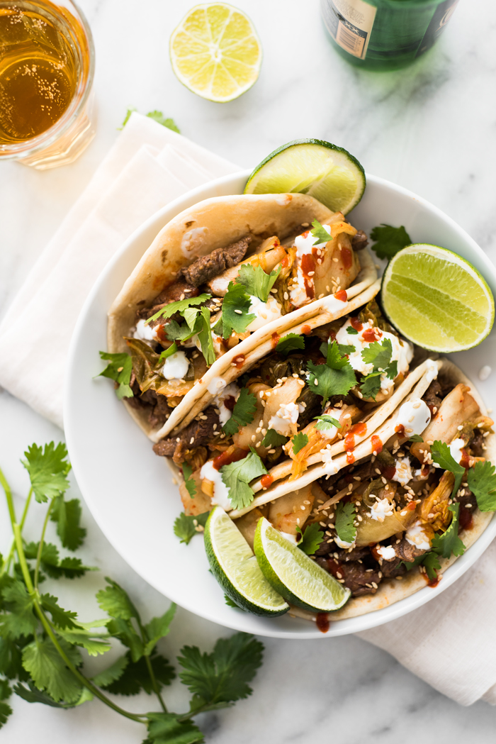 A full flavor experience - umami rich bulgogi beef, spicy kimchi, cool sour cream, and smoky Sriracha. You'll be devouring these Korean tacos!