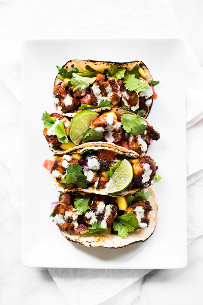 Blackened Shrimp Tacos with Black Bean Mango Salsa and Jalapeño Aioli - spicy, tangy, sweet, and completely delicious! Bring an appetite and lots of napkins! 
