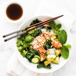 This noodle bowl is jam-packed with goodness! Pan seared salmon, garlicky kale, avocado... the list of greens goes on! Each bite is nutrient-rich and delicious!