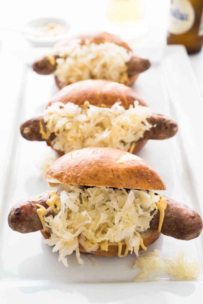 These beer brats are perfect for Oktoberfest, football parties, or just a damn good dinner!