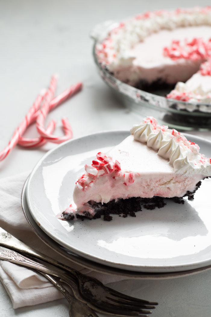 Fun, festive, and SO easy to make! This Candy Cane Ice Cream Pie is a dessert that everyone will love and it's totally customizable!